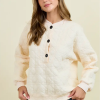 Cream quilted pullover with detail front buttons