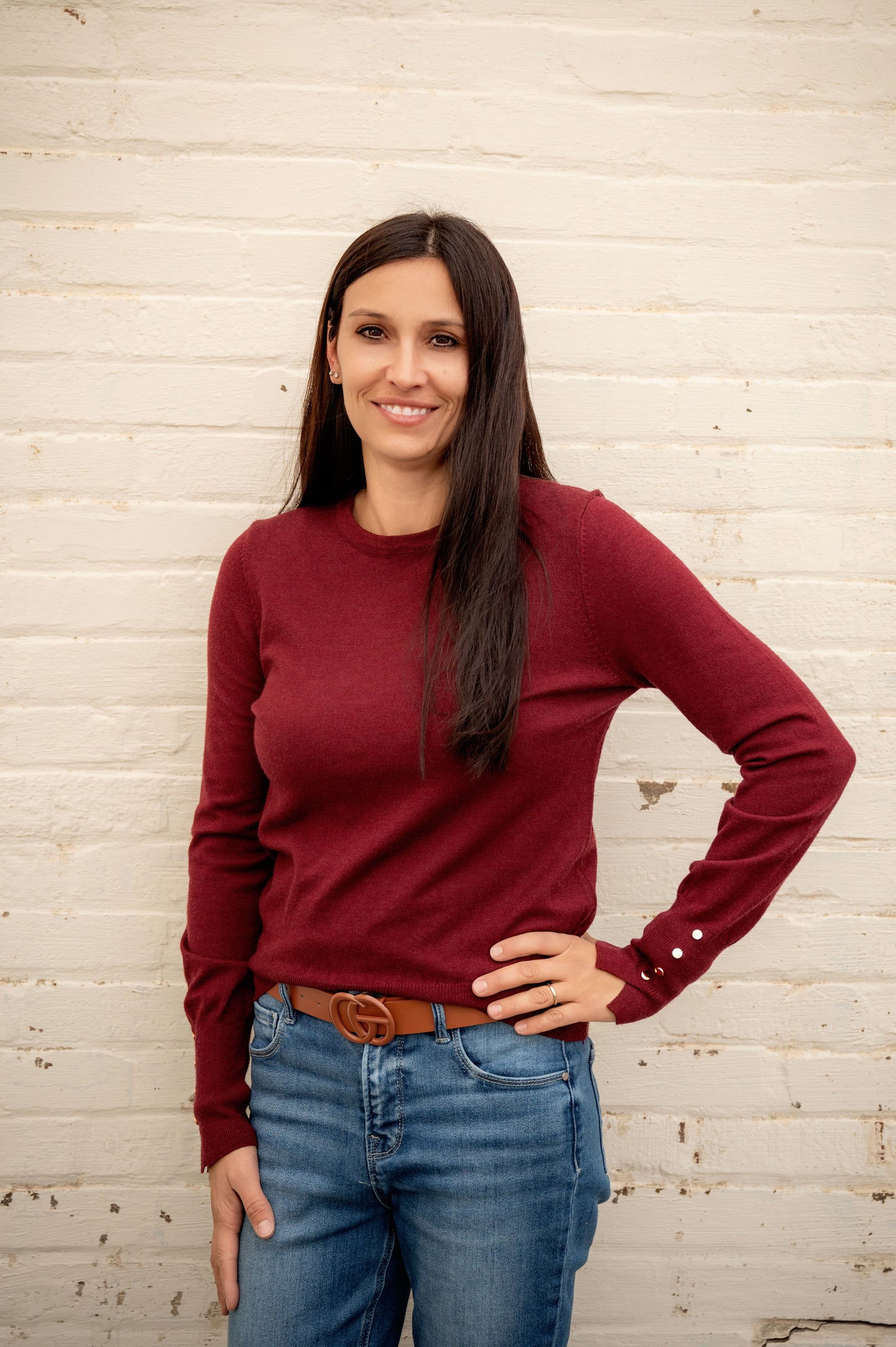 Women's long sleeve with gold detail buttons on sleeve. Maroon colored sweater slim fitting