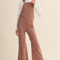 Girl wearing floral overall bibs