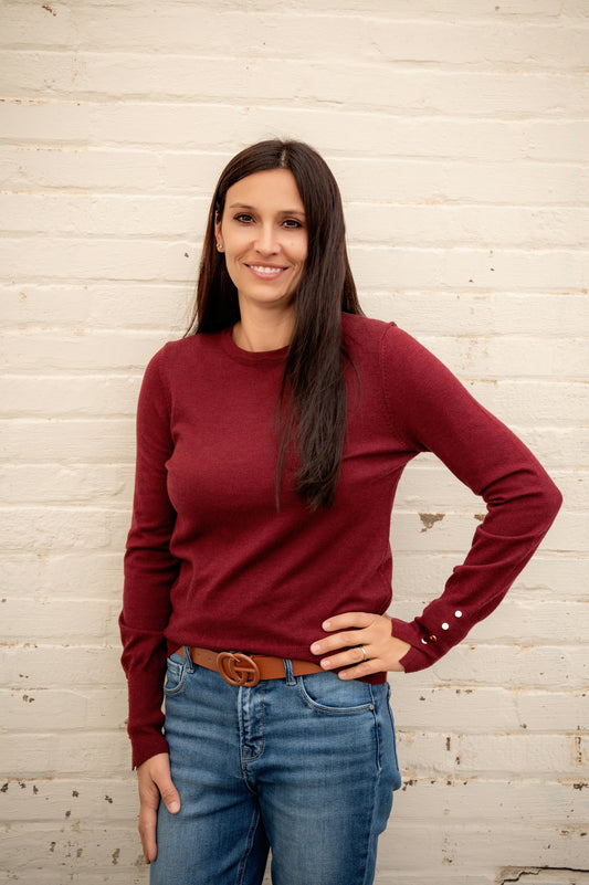 Women's long sleeve with gold detail buttons on sleeve. Maroon colored sweater slim fitting