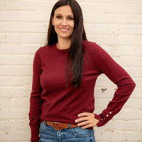 Women's long sleeve with gold detail buttons on sleeve. Maroon colored sweater slim fitting