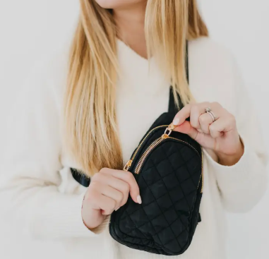 Sling puffer black bag with gold zipper