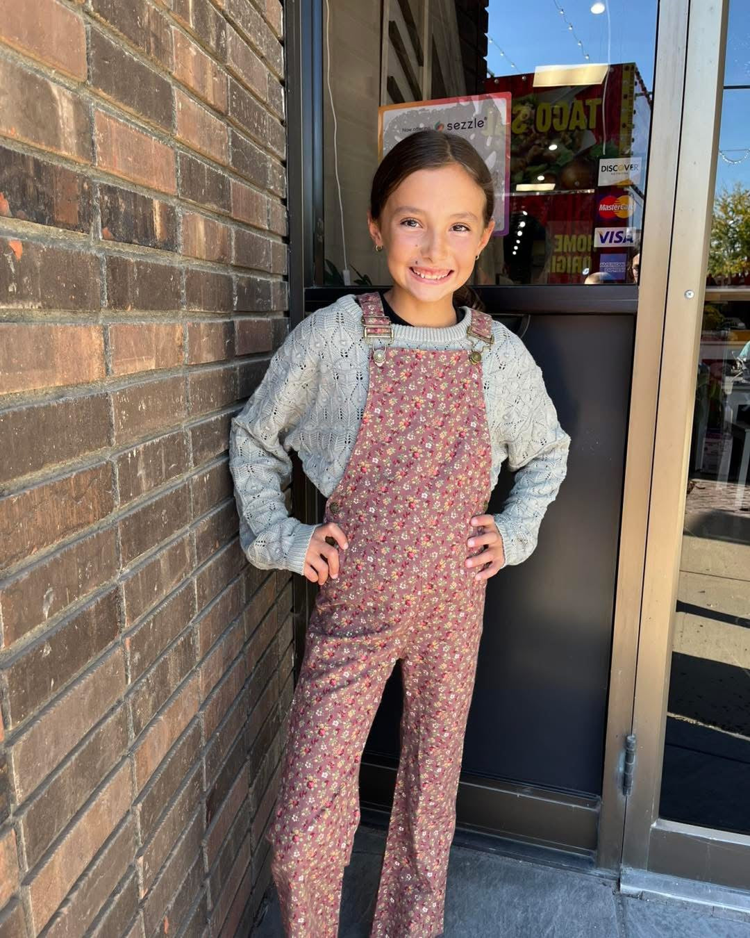 Tween girls bib overalls in floral print with light green sweater