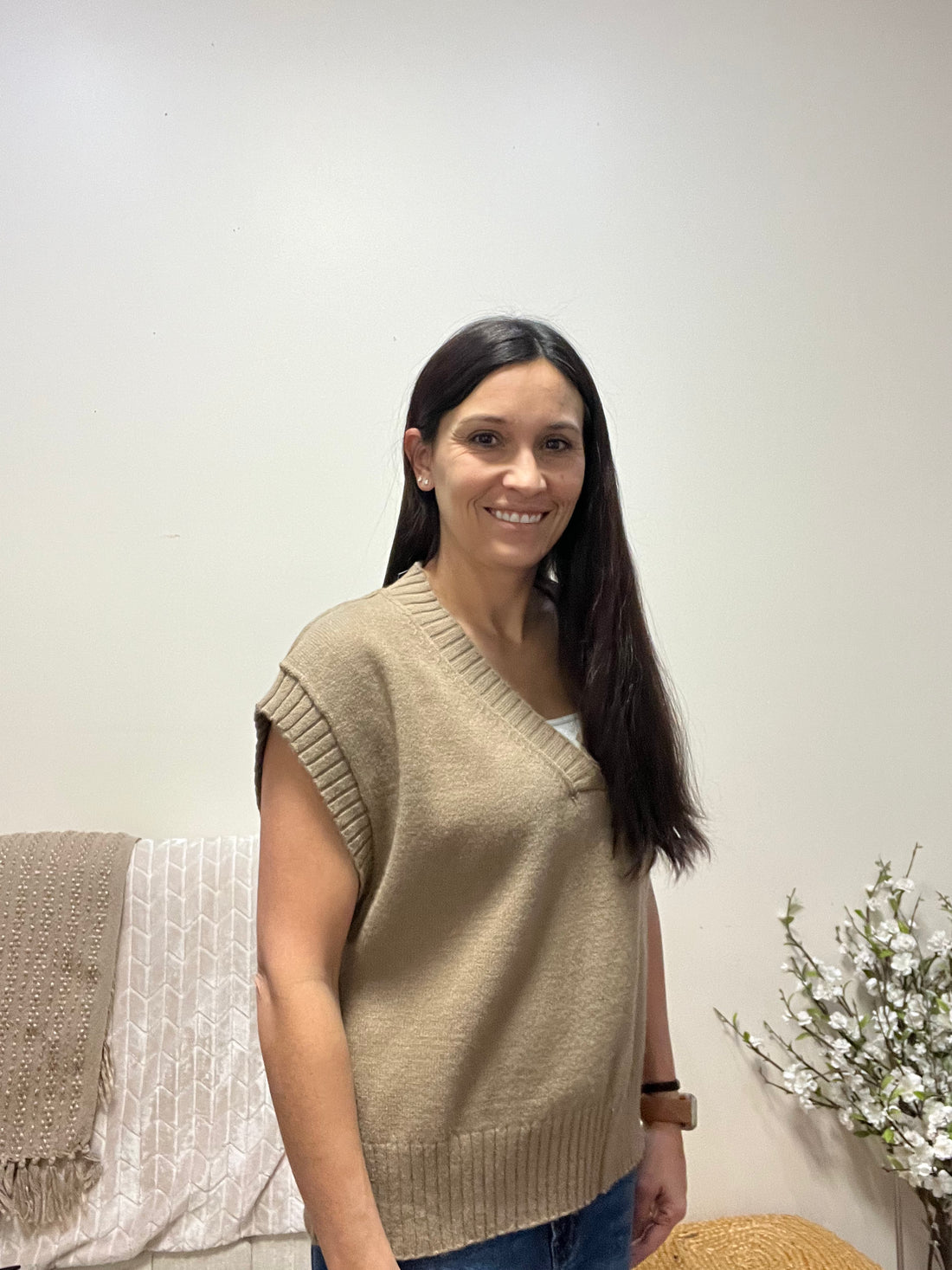 V neck sleeveless sweater in a brown/tan color 